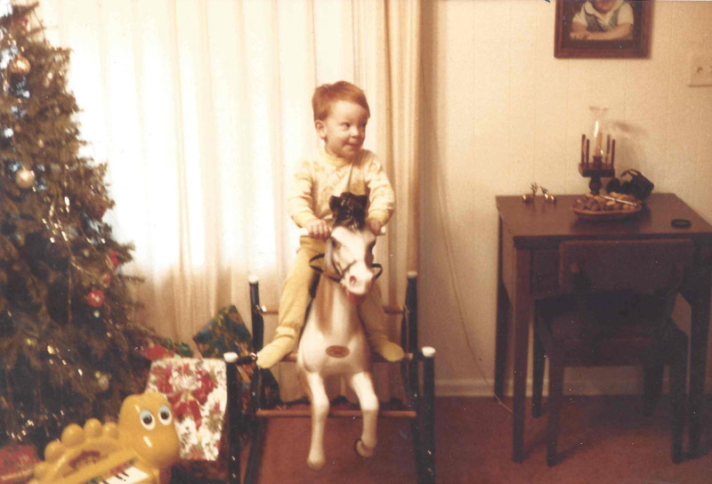Chris Porter as a kid on a toy horse