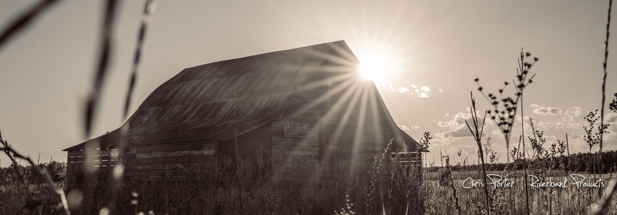 Barn with sun peaking from behind